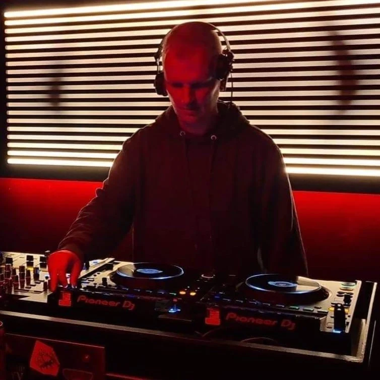 Aidy Smith DJ performing behind Pioneer DJ equipment